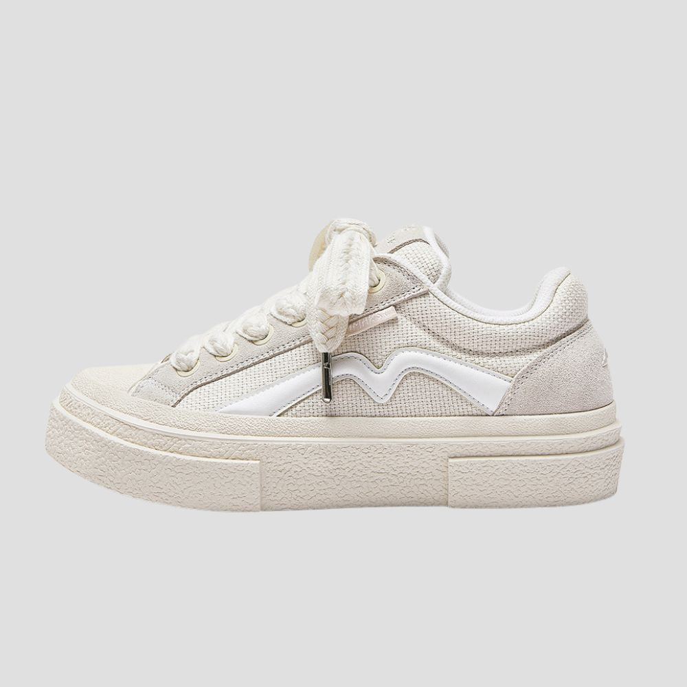 Elevate your style and height with these durable, low-top sneakers featuring a raised sole.