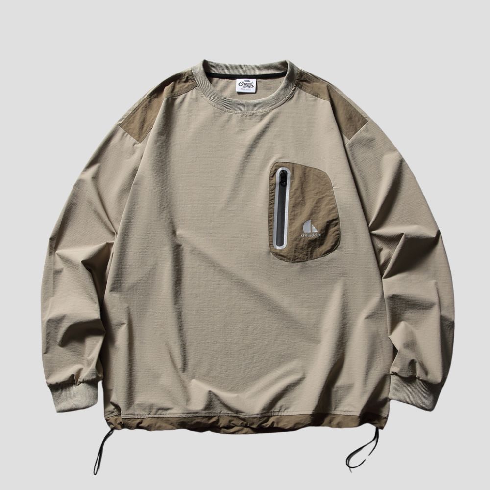 Sweatshirt with reflective pocket design and color block accents.