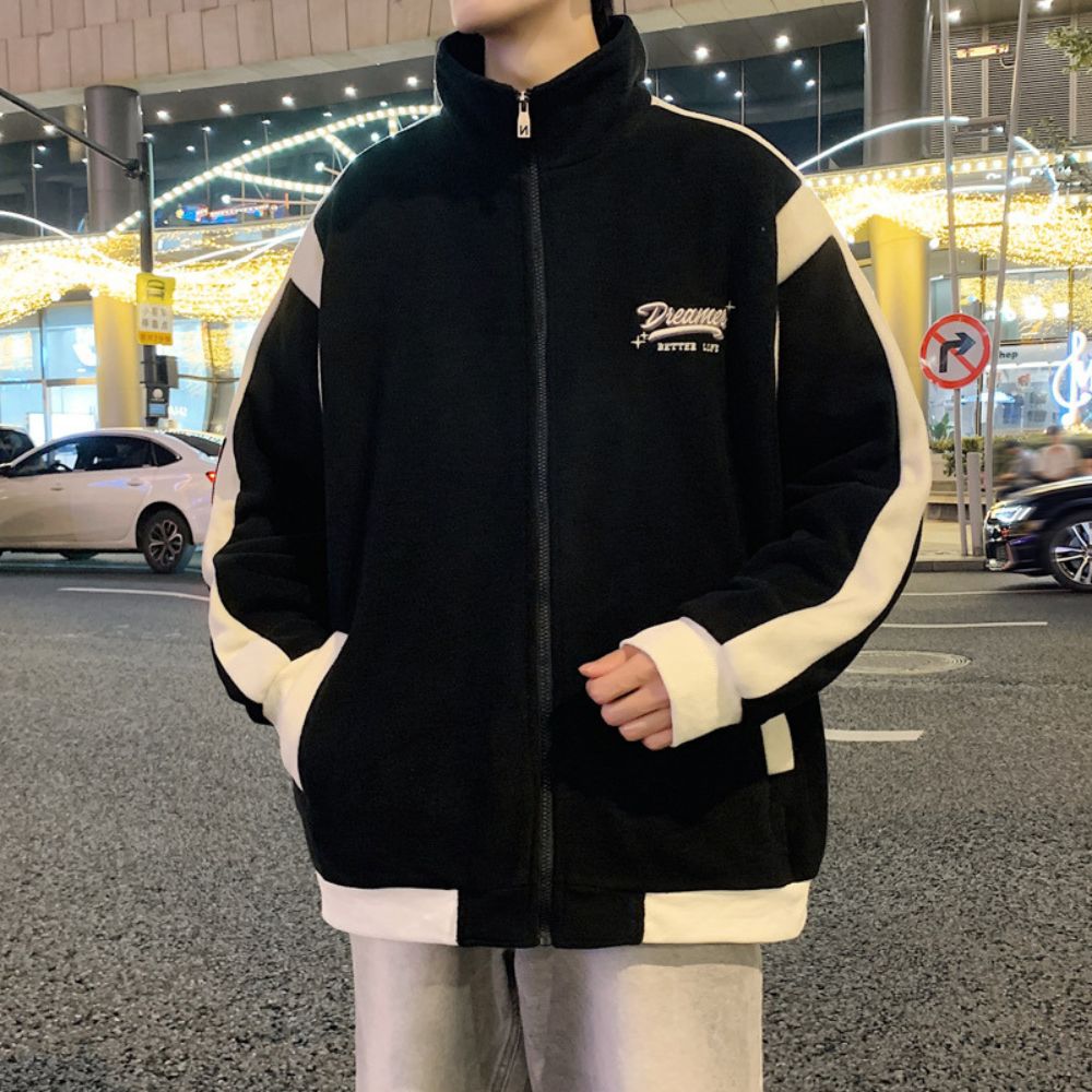 Model wearing the Patchwork Embroidered Jacket in an outdoor setting.