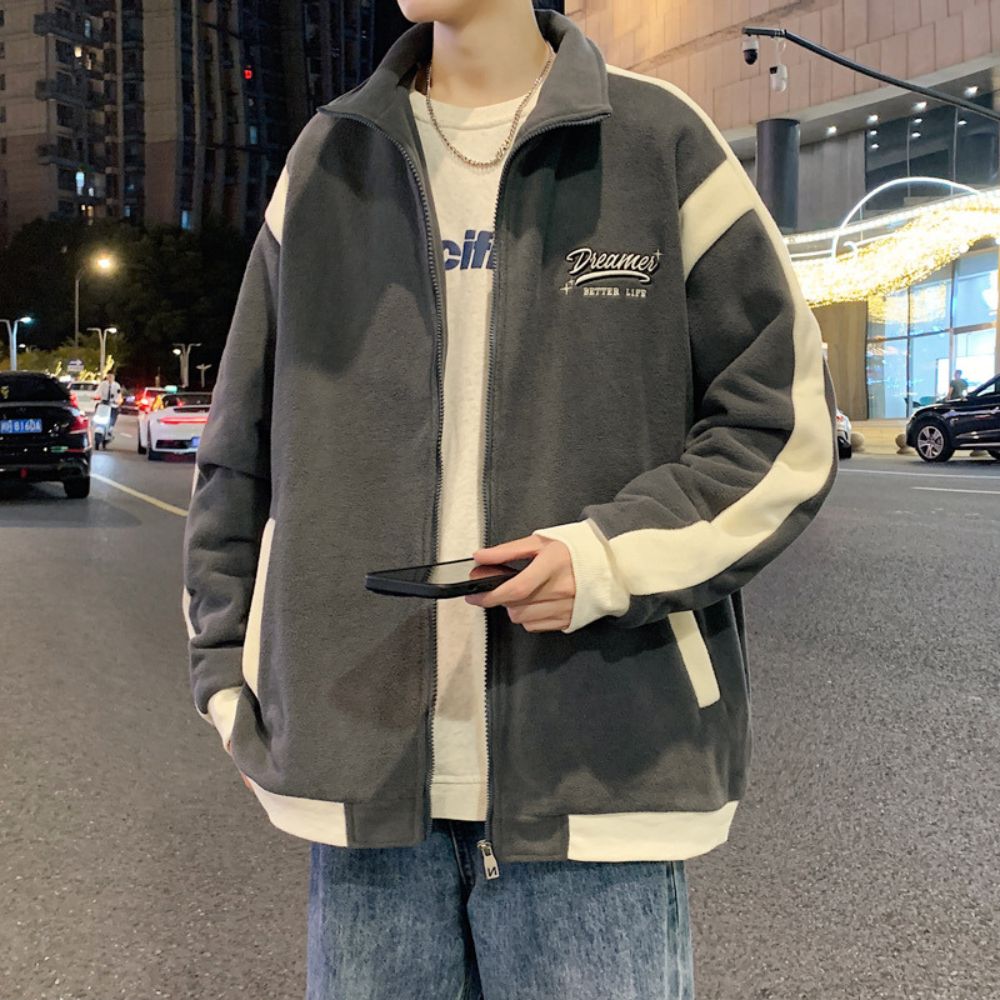 Model wearing the Patchwork Embroidered Jacket in an outdoor setting.