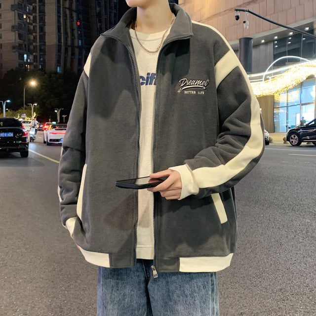 Model wearing the Patchwork Embroidered Jacket in an outdoor setting.