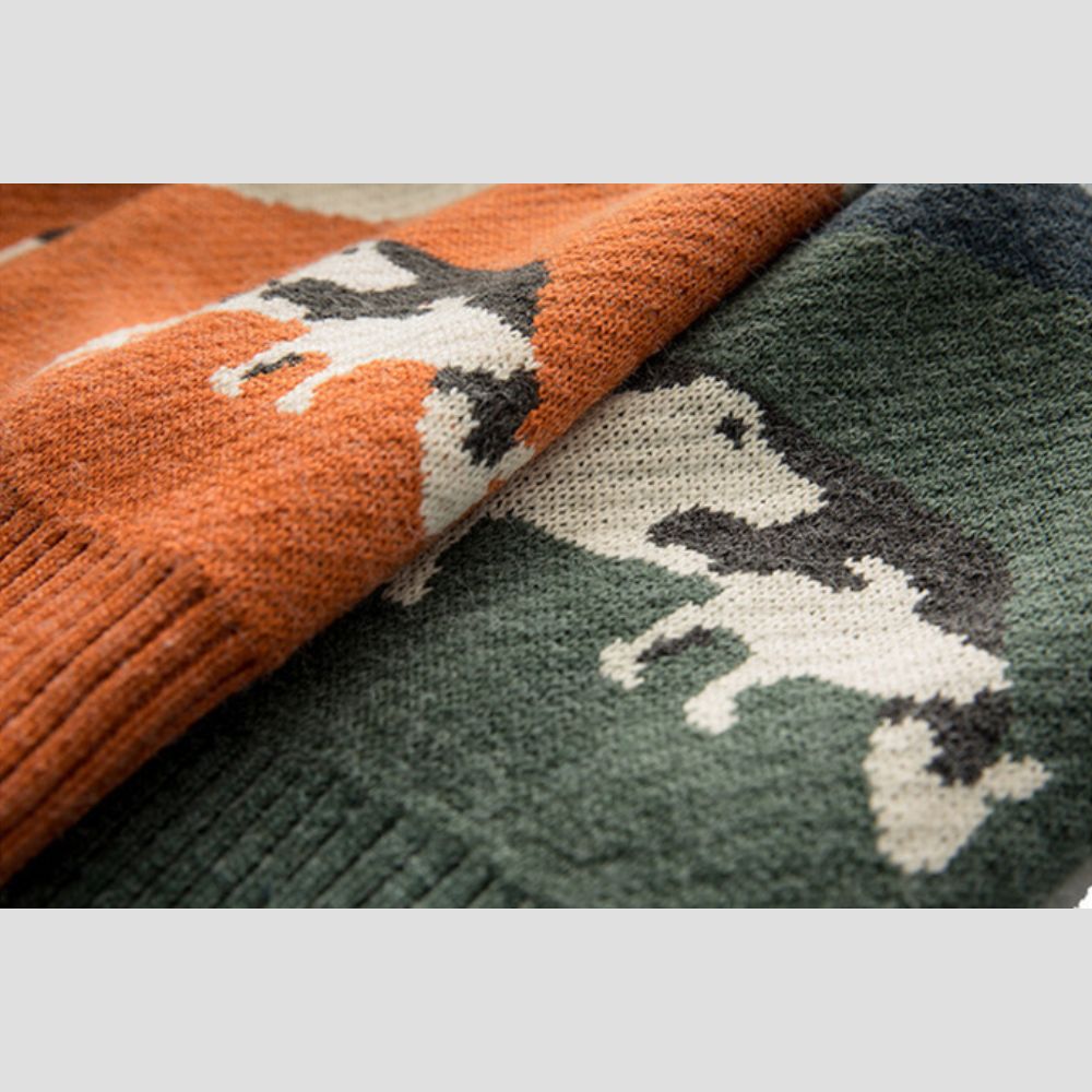 Loosely fitted sweater featuring a cow-inspired print