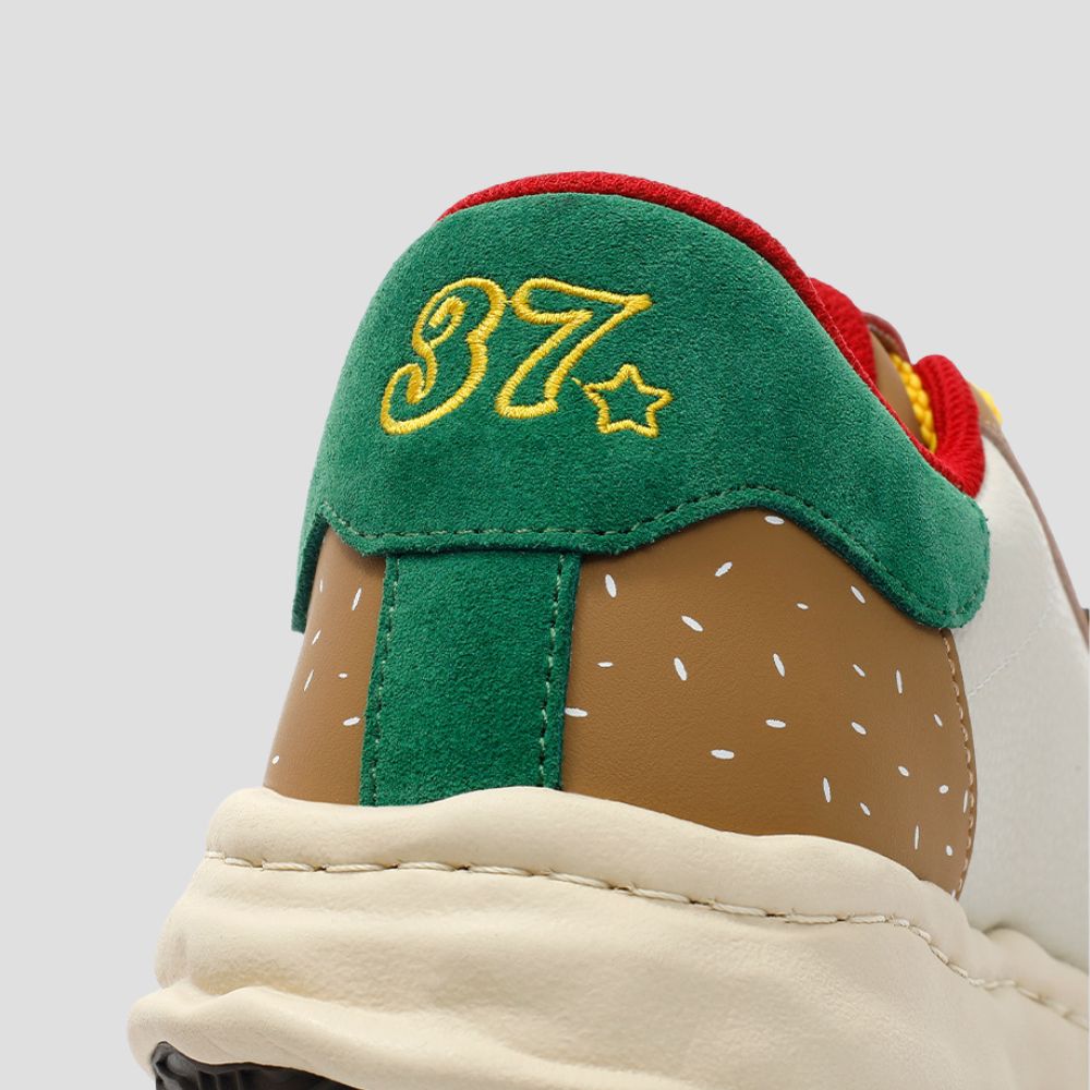 Take your outfit to the next level with these eye-catching shell toe sneakers, perfect for any occasion.