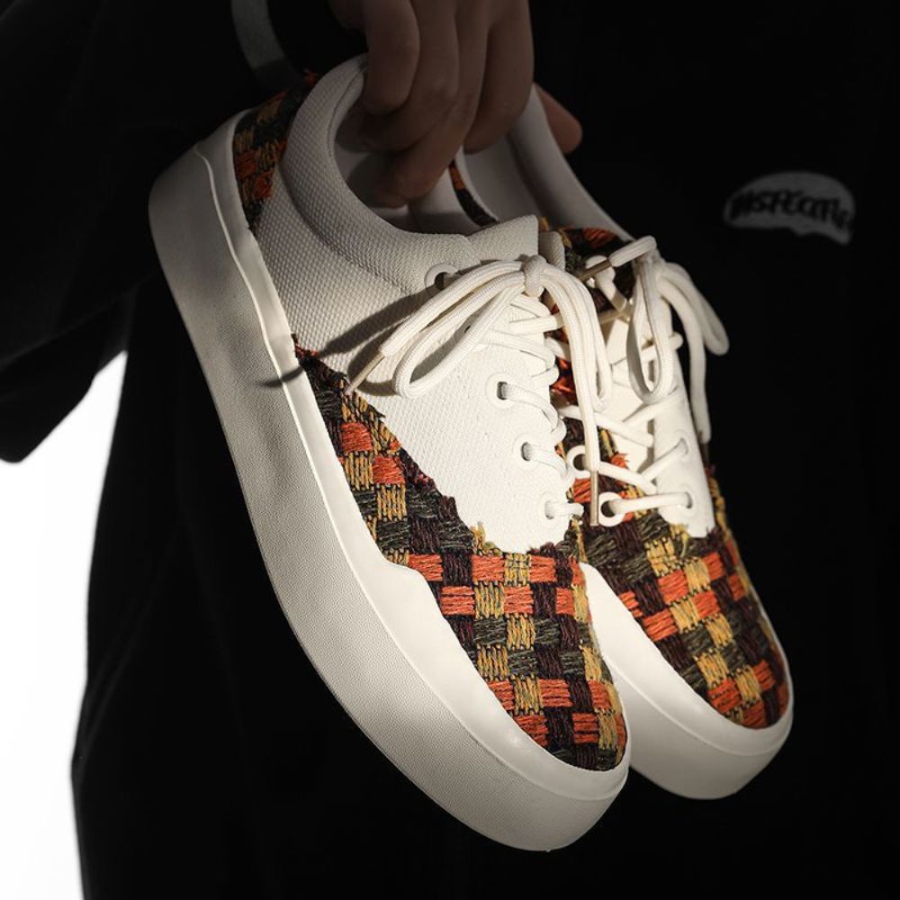 Elevate your look with these stylish sneakers featuring a thick sole and trendy fringe design.