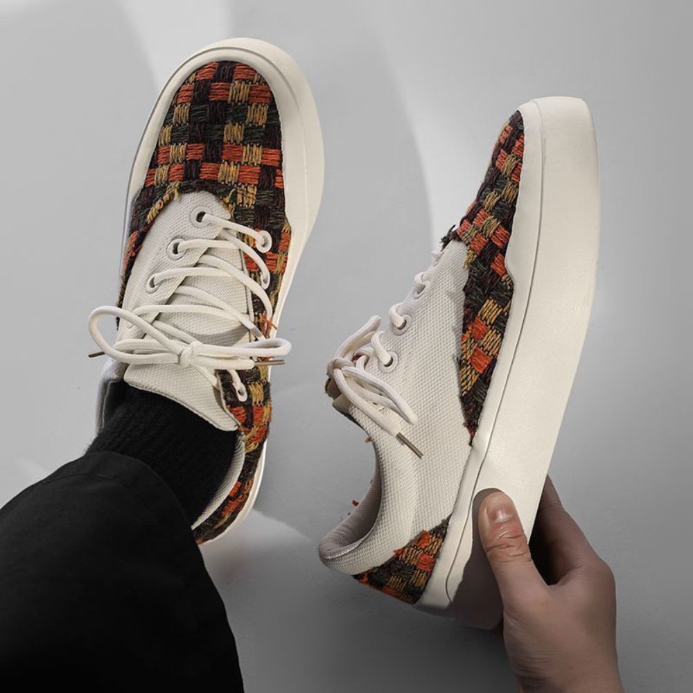 Stand out in any crowd with these eye-catching fringe sneakers, perfect for both men and women.