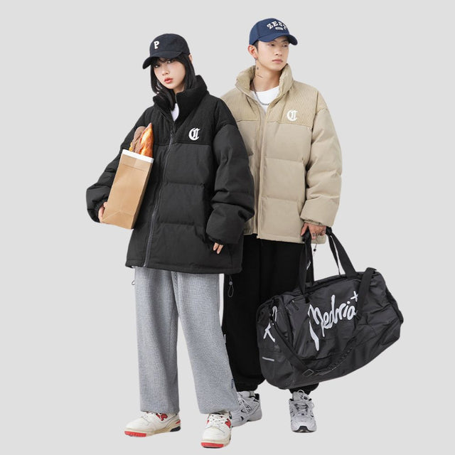 The jacket displayed in a snowy environment to emphasize warmth.