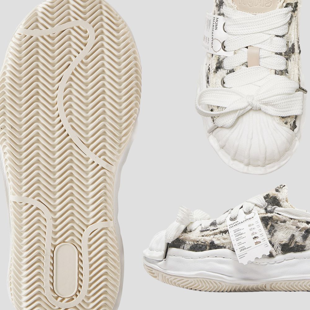 Elevate your height and your look with these chic sneakers featuring a thick sole and cotton upper.