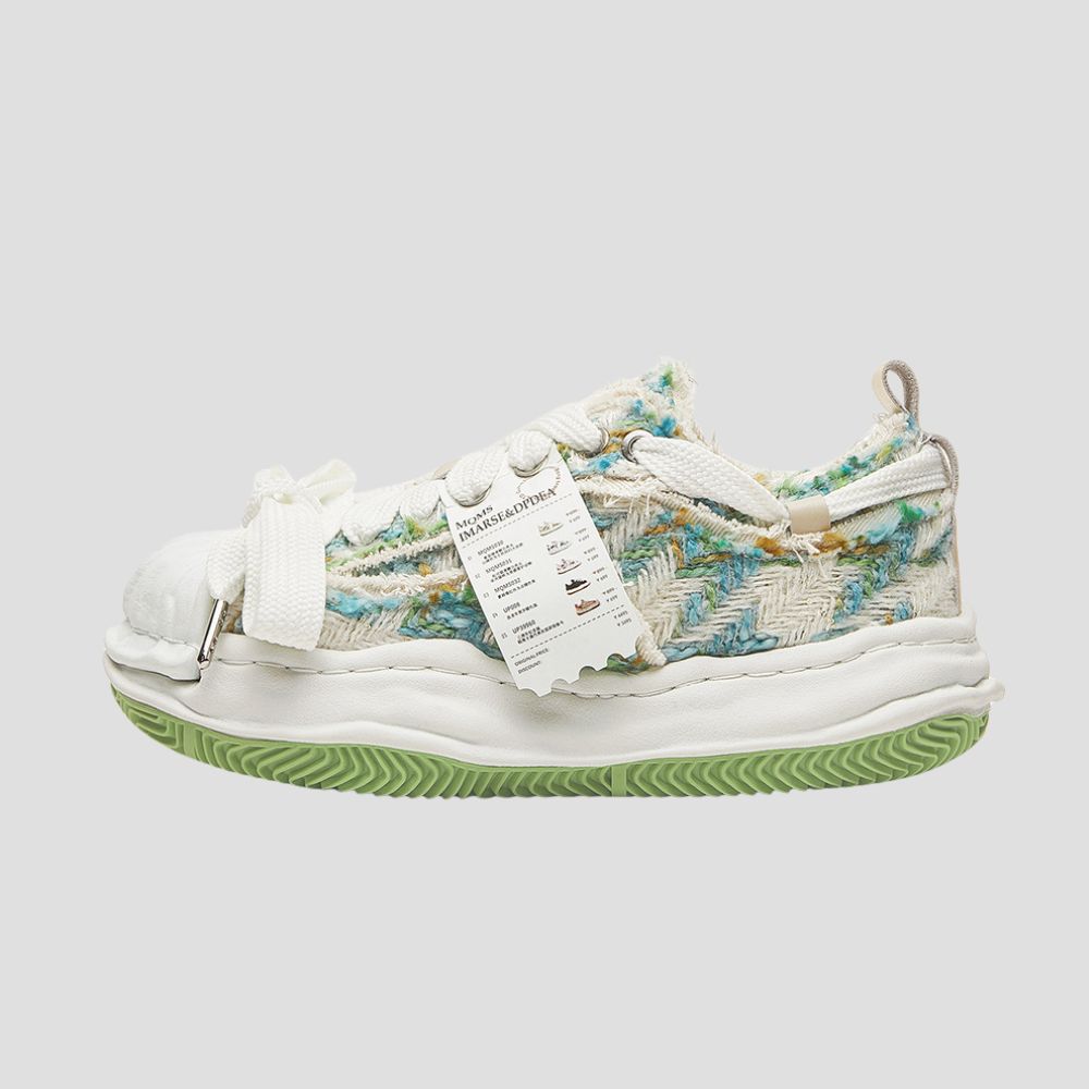 Elevate your style with these cotton fabric sneakers featuring a dissolved design.