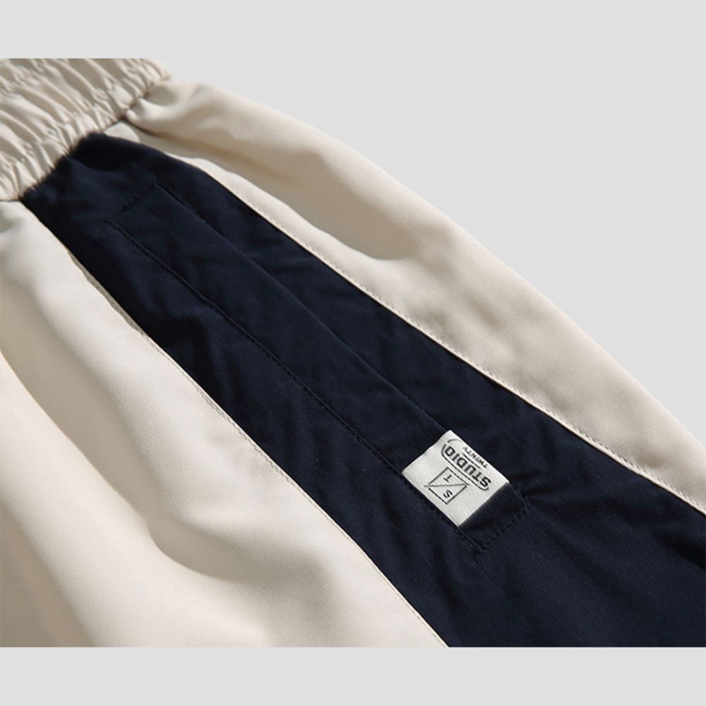 Casual pants featuring color-blocked stripes