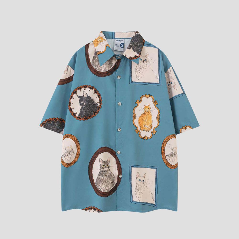 Unisex shirt with cat graffiti, button closure, and turn-down collar.