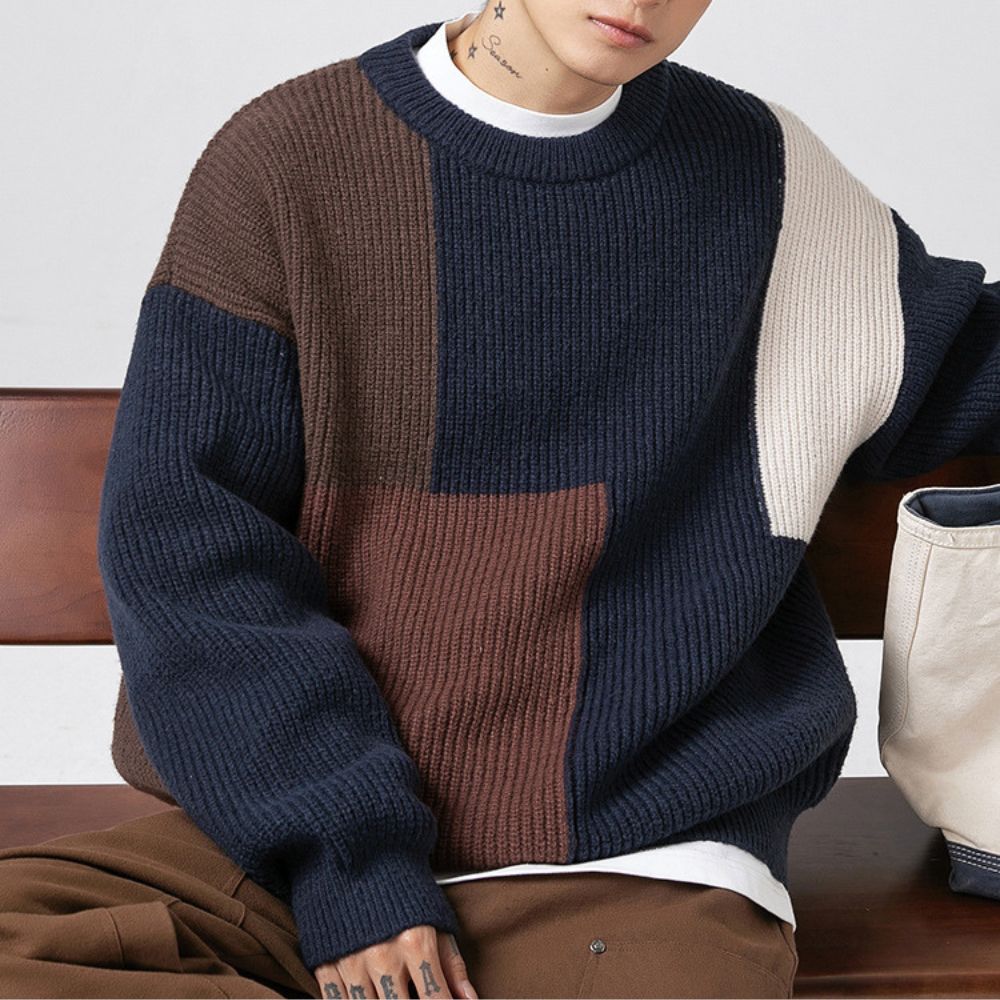 Detailed view of the long sleeves on the Color Block Patchwork Sweater