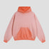  The rear of the color-blocked hooded sweatshirt, displaying the cozy hood and color-blocking design in full.