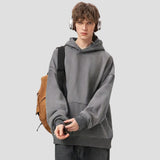 color-blocked hooded sweatshirt with the hood up, showcasing the adjustable drawstrings