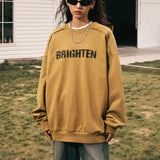 Female model wearing the Distressed Letter Printed Sweatshirt for a stylish look