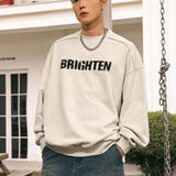 Male model showcasing the unisex Distressed Letter Printed Sweatshirt