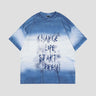 Vintage distressed tee featuring gradient colors and urban flair.