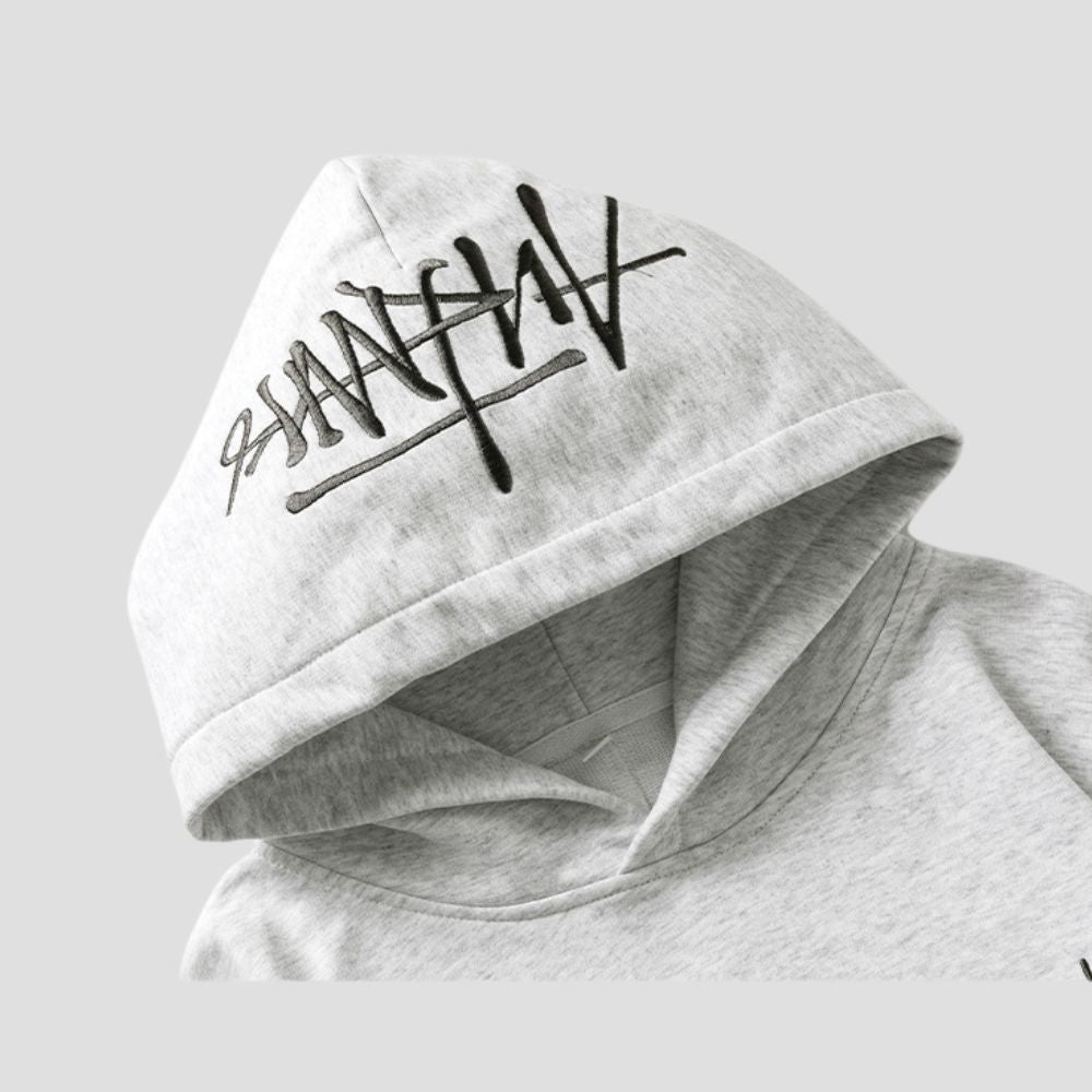 Sleeve of the Hand-Drawn Letter Hoodie, featuring the hand-drawn letter design and elastic cuffs.