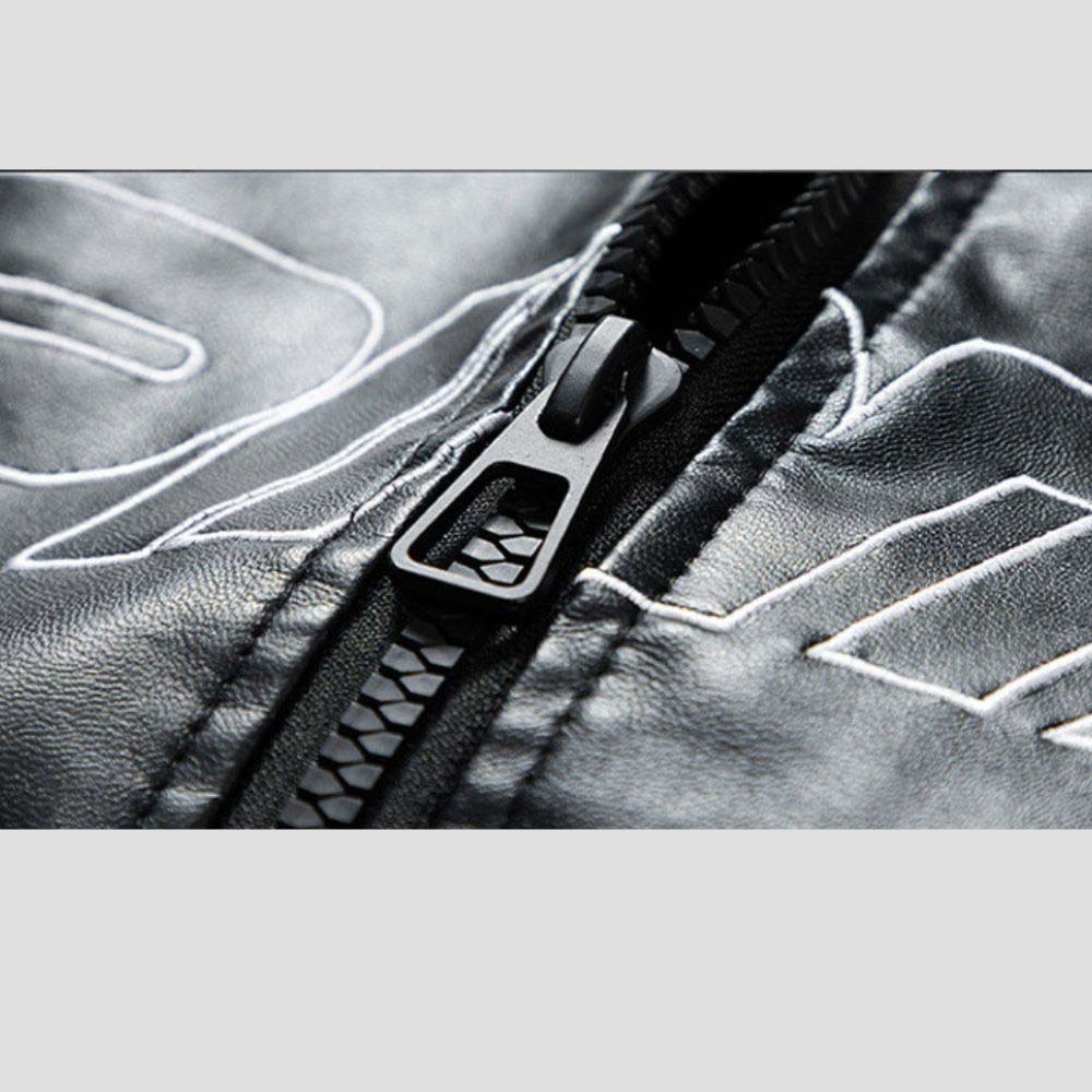 Close-up of intricate graffiti designs on a stylish jacket.