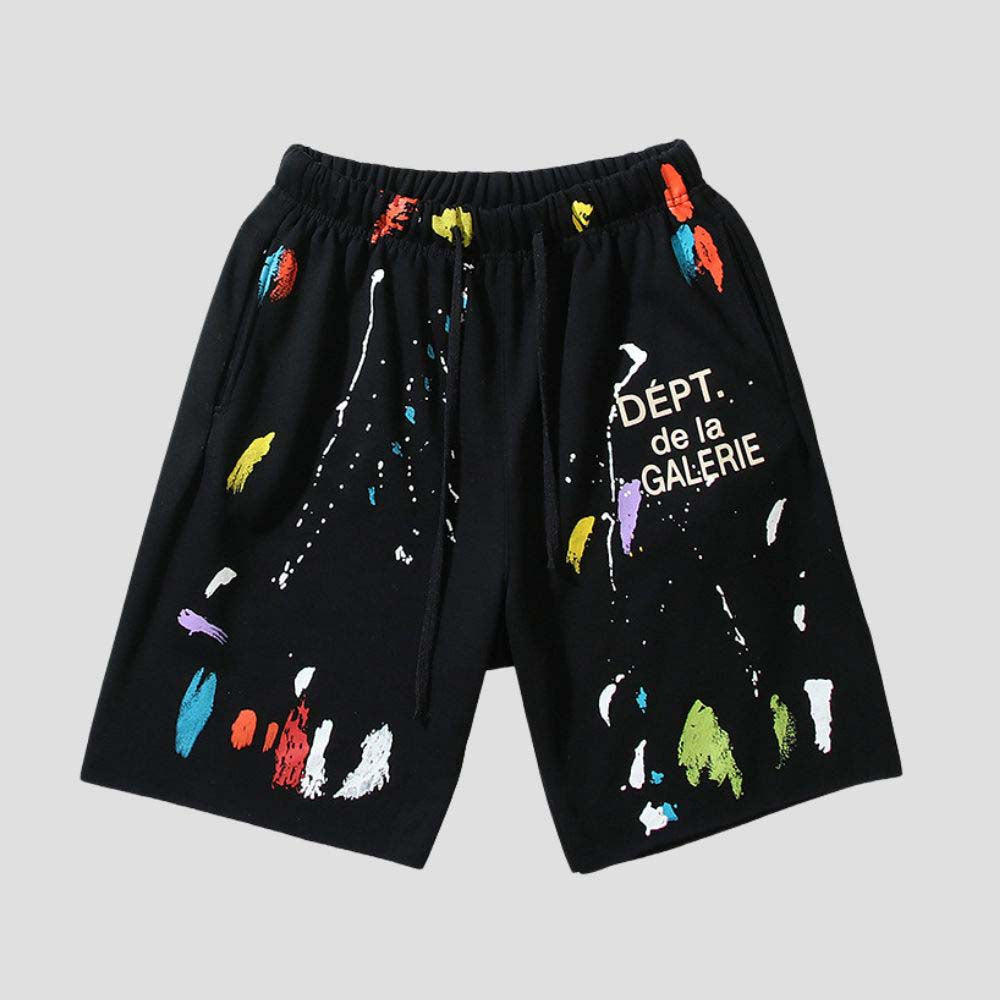 Loose-fit unisex shorts with quick-dry fabric and artistic ink splatter