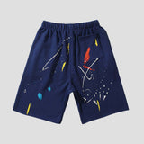 Unisex loose-fit shorts featuring ink splatter graffiti