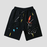 Street-style hip-hop shorts with ink splatter graffiti