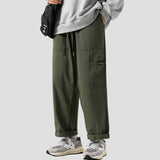 Side view showing the straight-leg fit and relaxed silhouette of the pants