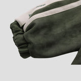 Detail of the jacket's zipper, emphasizing its smooth operation and durability