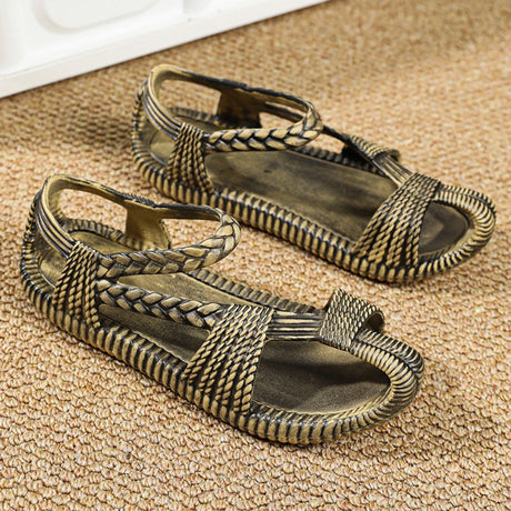 Comfortable and stylish bronze sandals featuring a unique ethnic design.