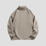 Stylish sweater featuring ribbed high-neck and loose fit
