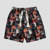 Street fashion patchwork graffiti shorts.