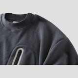 Cozy sweatshirt with a bold design and modern reflective touch.
