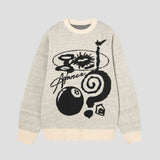 Vintage style sweater with artistic graffiti and soft fabric.
