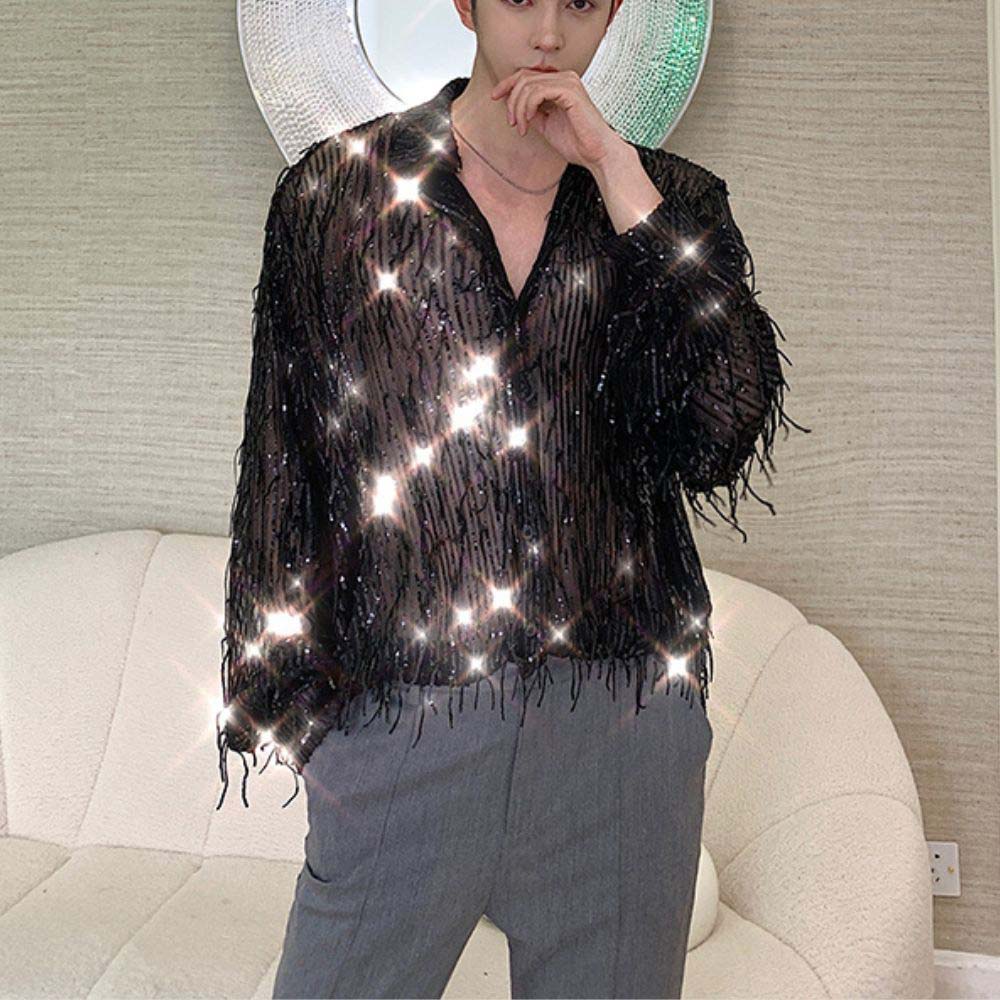 Model wearing sheer fabric sequin fringe shirt in stylish avant-garde fashion.