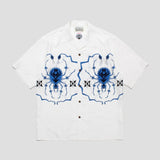 Comfortable shirt with spider embroidery, recycled fibers, and street fashion elements.