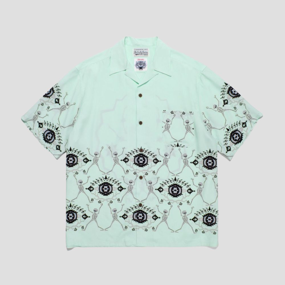 Trendy shirt with spider embroidery, loose fit, cooling fabric, and travel style.