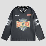 Hip-hop style tee with unique perforated design and graffiti embroidery.