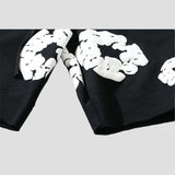 Unisex loose-fit shorts featuring white floral print