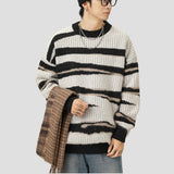 Loose fit zebra striped sweater with eco-friendly materials.
